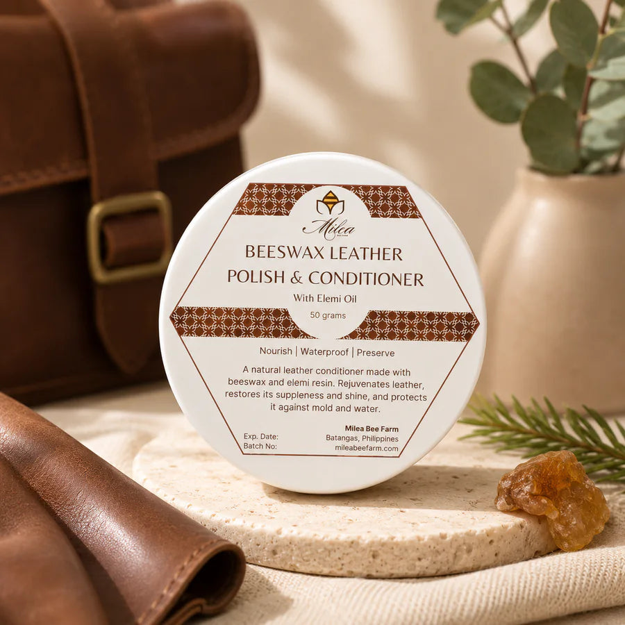 Milea Beeswax Leather Polish and Conditioner beside leather goods